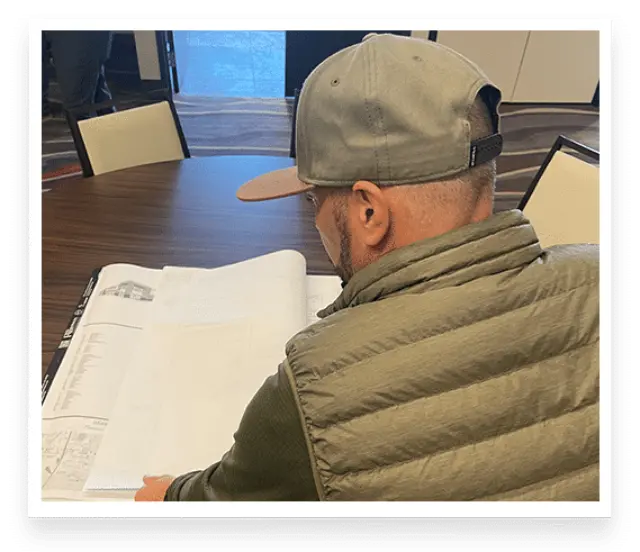 Photo of Tucson Asphalt Contractors employee reviewing paperwork for ESOP