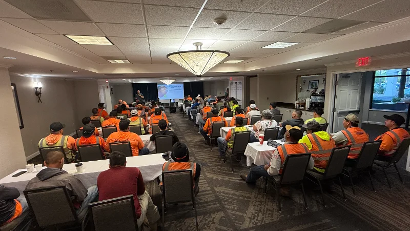 Photo of company-wide presentation at TAC showcasing leadership and safety