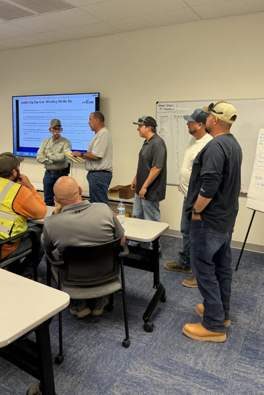 TAC employees focused at a presentation